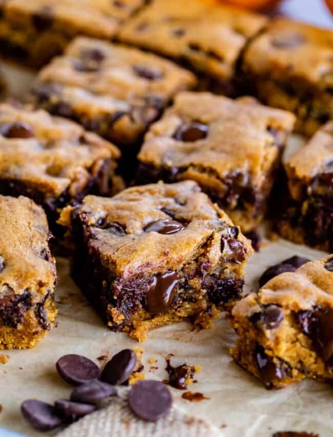 pumpkin bars with chocolate chips sliced on a pan.