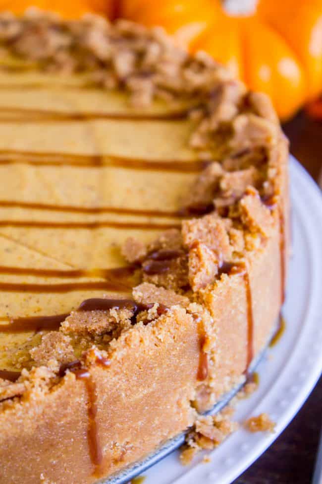 double layer pumpkin cheesecake with graham cracker crust and caramel sauce.