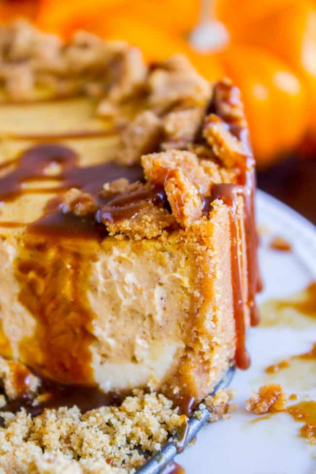 pumpkin cheesecake with caramel sauce and graham cracker crust.