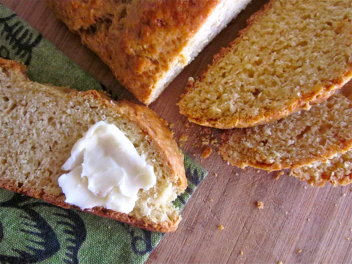 IMG_2485 sliced Irish soda bread with butter spread on a slice.