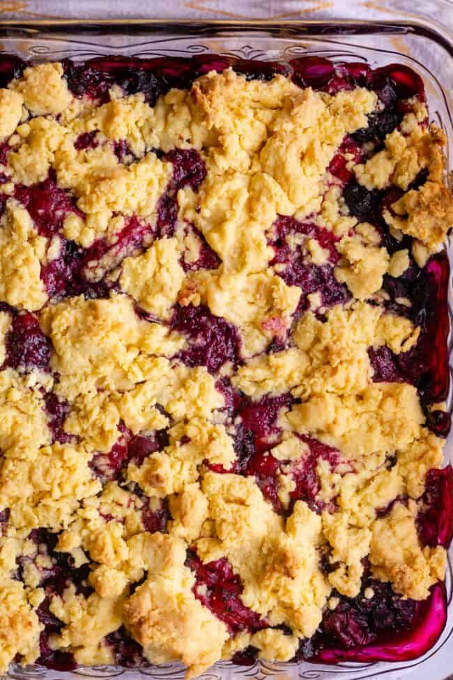 berry cobbler in a glass pan.