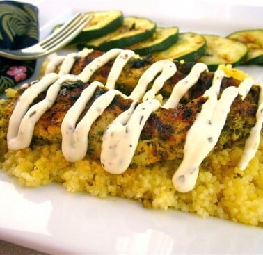 Pesto Chicken with Italian Cream Sauce over Parmesan Couscous from TheFoodCharlatan.com