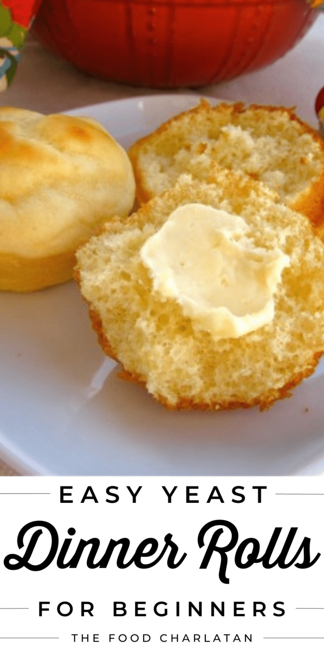 easy yeast dinner roll torn in half with a pat of butter.