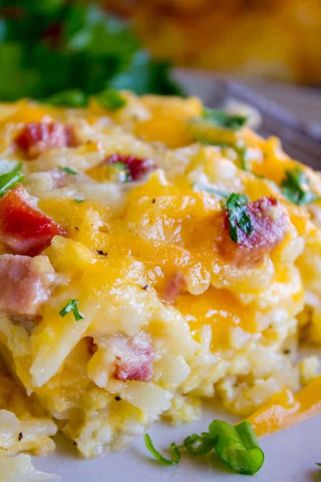 hash brown egg casserole close up showing cheese, egg, potato, and chives for breakfast