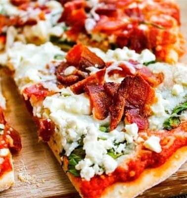 Spinach, Bacon, & Feta Pizza with Sun-Dried Tomato Sauce from The Food Charlatan