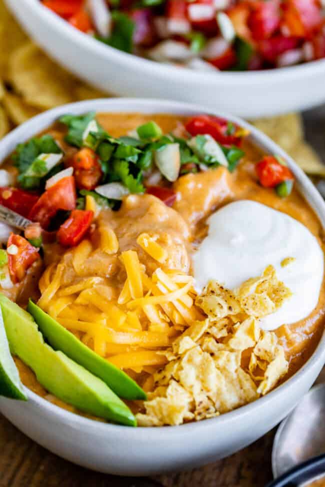 chicken enchilada soup with garnishes.