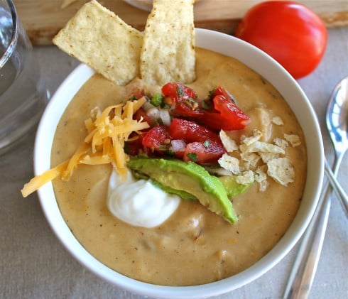 chicken enchilada soup in a white bowl.