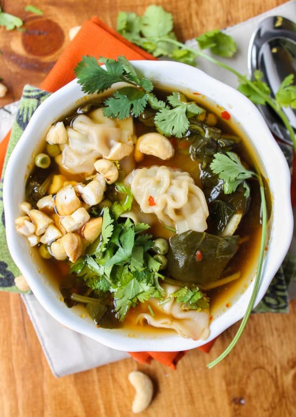 wonton soup in a white bowl.