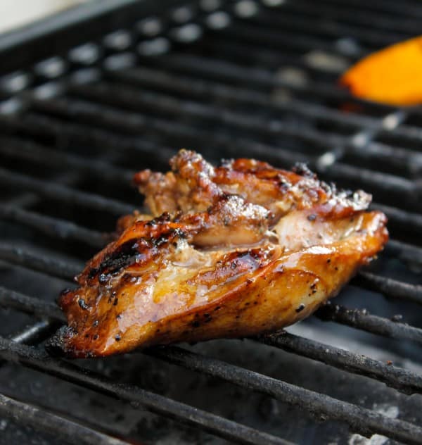 Balsamic Grilled Chicken with Spicy Honey Bacon Glaze from The Food Charlatan. This balsamic grilled chicken is SO full of flavor from the marinade. A quick stint on the grill and a 4-ingredient sauce top it off. Oh, did I mention the spicy honey and bacon? Yeah. #chicken #grilledchicken #grill #honey #bacon #marinade #balsamic #glaze #summer #healthy #recipe Grilled Chicken Marinade