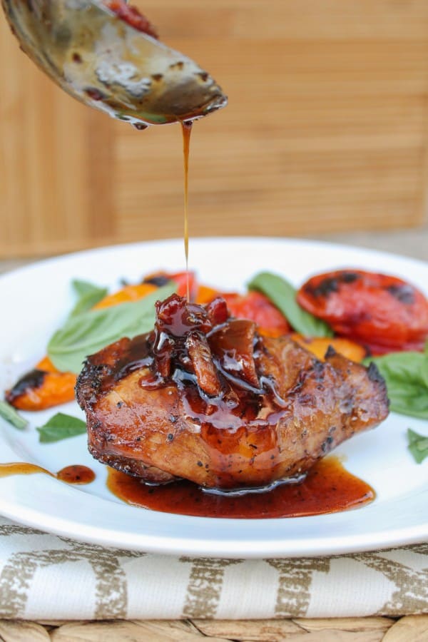 Balsamic Grilled Chicken with Spicy Honey Bacon Glaze from The Food Charlatan. This balsamic grilled chicken is SO full of flavor from the marinade. A quick stint on the grill and a 4-ingredient sauce top it off. Oh, did I mention the spicy honey and bacon? Yeah. #chicken #grilledchicken #grill #honey #bacon #marinade #balsamic #glaze #summer #healthy #recipe Spicy Honey Bacon Glaze on Grilled Chicken