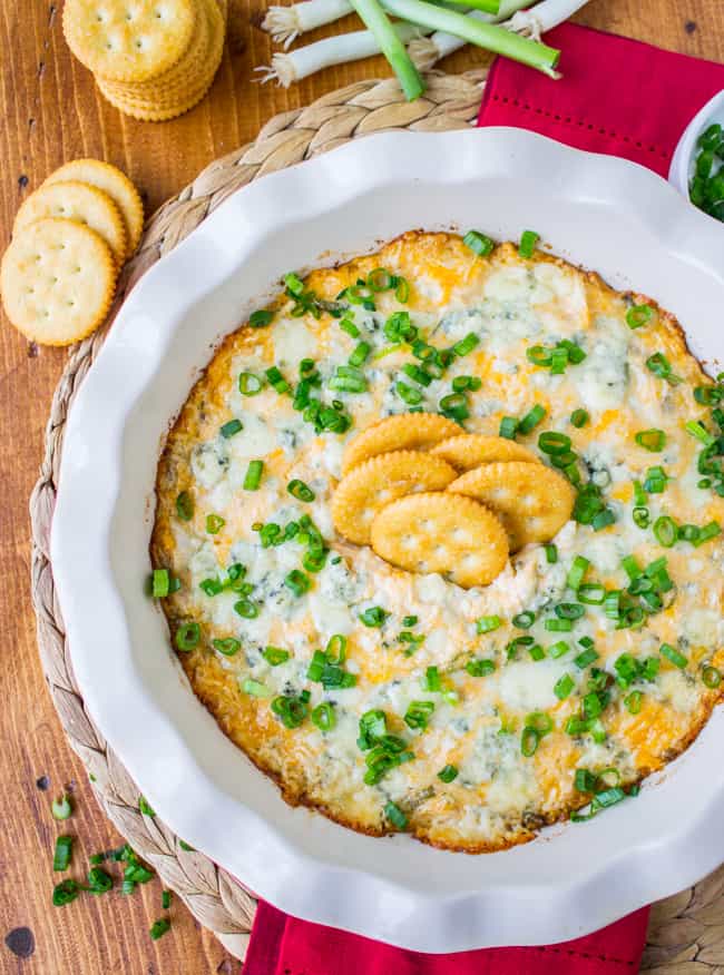 Crackers in easy buffalo chicken dip.