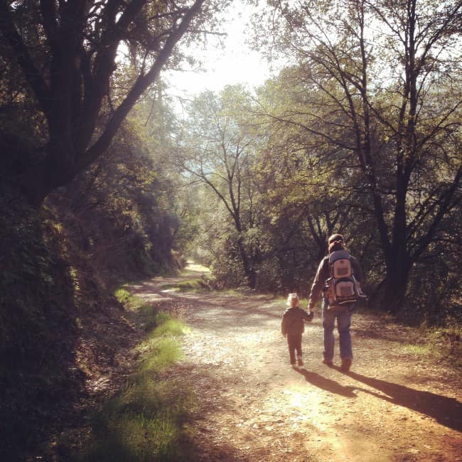 Father and two small children on hike.