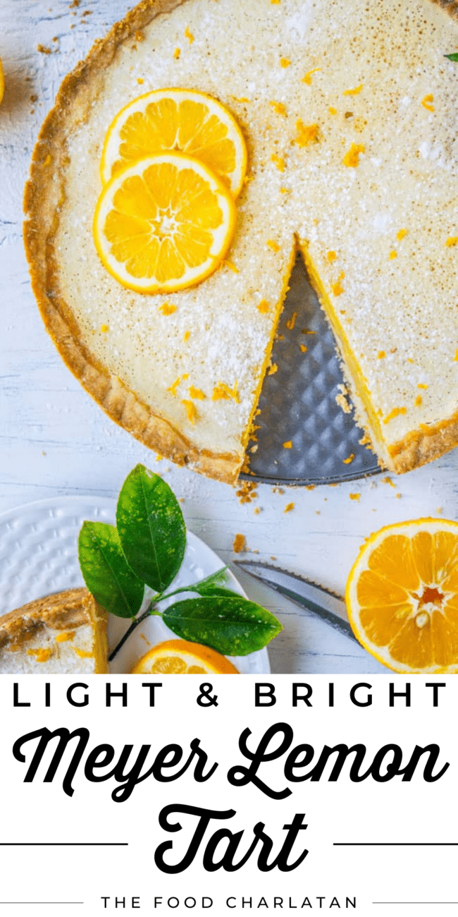 meyer lemon tart with a slice cut from it.