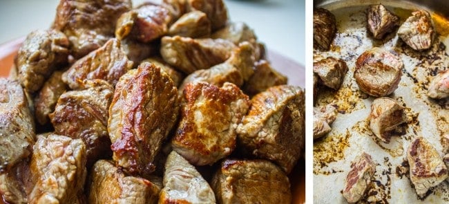 browning pieces of beef in a pan. 