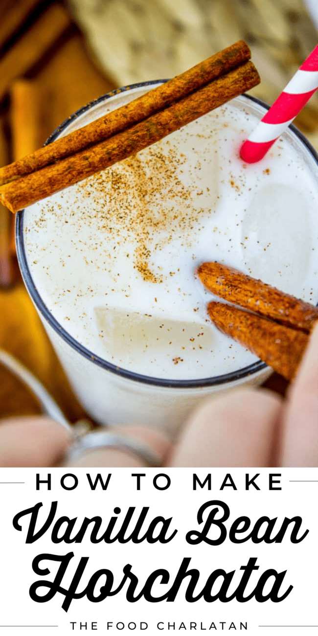 vanilla bean horchata with a cinnamon stick across the glass.