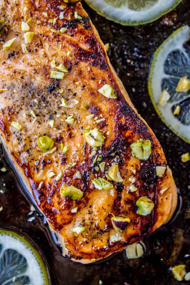 close up shot of salmon with pistachios.