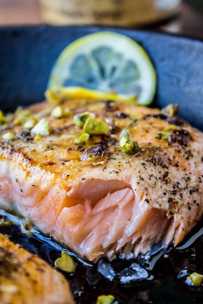 Tender salmon with maple glaze and pistachios on a plate. 
