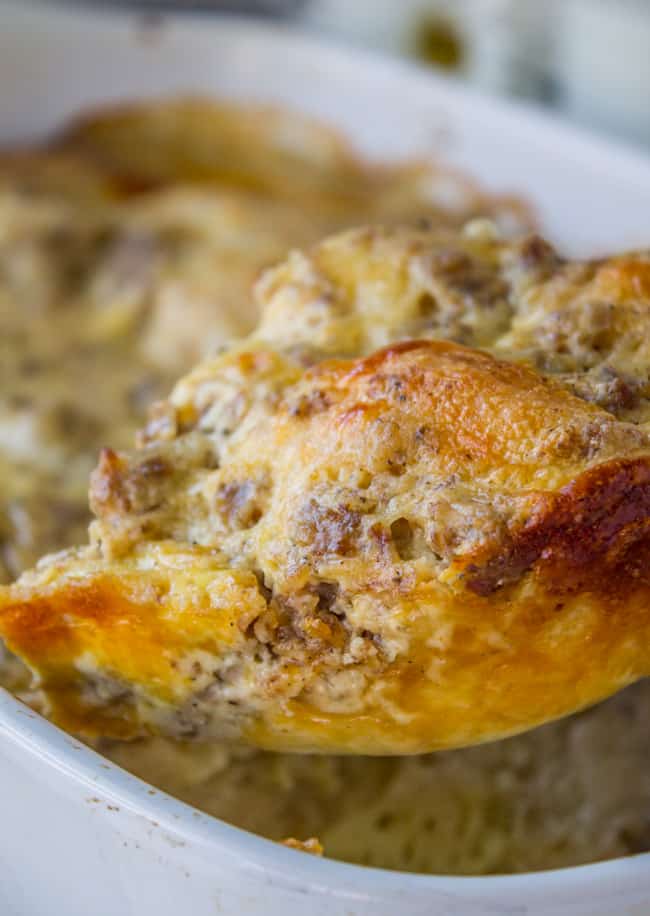 Overnight Biscuits and Gravy Casserole from The Food Charlatan. A quick and easy Biscuits and Gravy Casserole that you can make the night before! Just throw it in the oven in the morning. Use canned biscuits but homemade gravy. It is perfect for Christmas breakfast! #biscuits #gravy #breakfast #casserole #easy #overnight #makeahead #eggs #homemade biscuit and gravy breakfast casserole.
