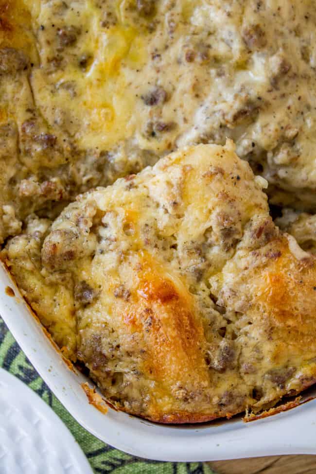 Overnight Biscuits and Gravy Casserole from The Food Charlatan. A quick and easy Biscuits and Gravy Casserole that you can make the night before! Just throw it in the oven in the morning. Use canned biscuits but homemade gravy. It is perfect for Christmas breakfast! #biscuits #gravy #breakfast #casserole #easy #overnight #makeahead #eggs #homemade biscuit and gravy breakfast casserole.