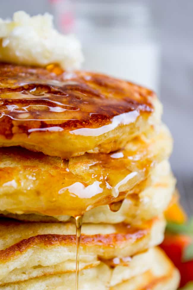The Best Pancakes I've Ever Made from The Food Charlatan. EUREKA! The Best Pancakes Ever. Guys, I'm not even kidding when I say I've been looking for this buttermilk pancake recipe for my entire life. They are fluffy, crispy on the edges, tender in the middle, and completely stackable. The search is over!! #pancakes #buttermilk #fluffy #crispyedges #easy #fromscratch #sourcream #delicious #breakfast #brunch A stack of pancakes covered in butter and syrup.
