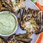 Garlic Roasted Artichokes with Pesto Dipping Sauce from The Food Charlatan