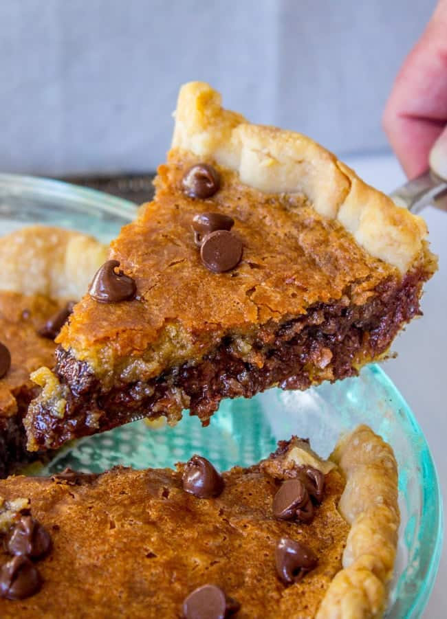 Chocolate Chip Pie Recipe in a clear pie tin. 