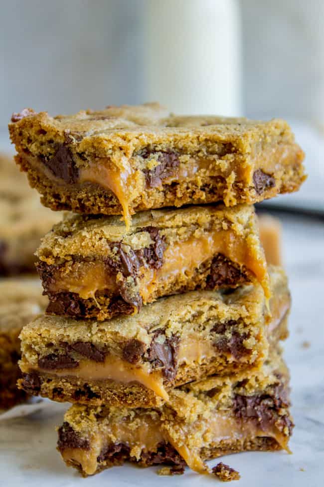 a stack of gooey carmelitas, some with bites taken out of them.