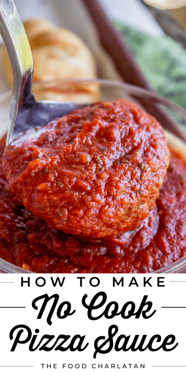 a ladle full of pizza sauce.