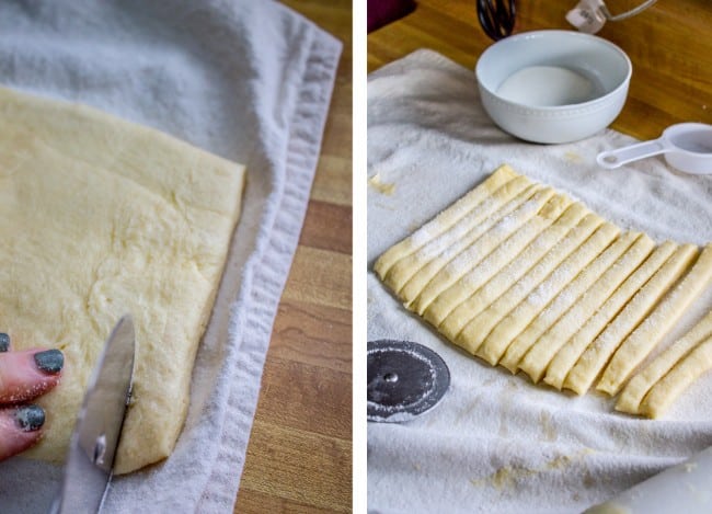 strips of cookie dough dusted with sugar, on a cheesecloth. 