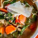 Slow Cooker Chicken, White Bean, and Kale Soup with Parmesan Shavings from The Food Charlatan