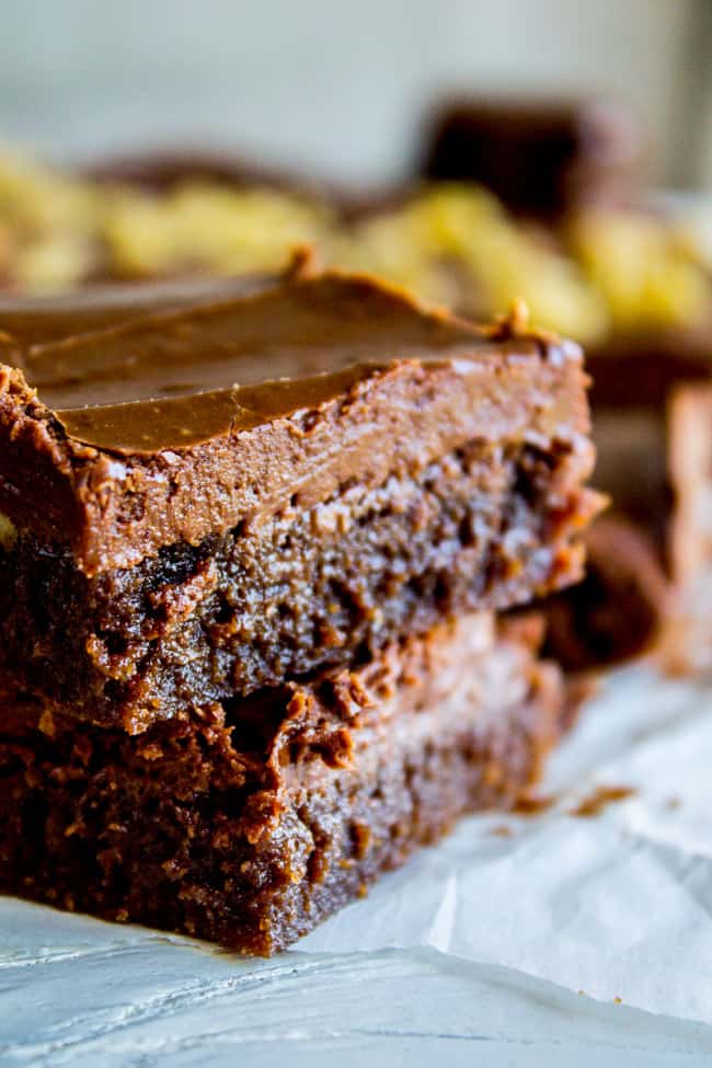 stack of fudge brownies with frosting.