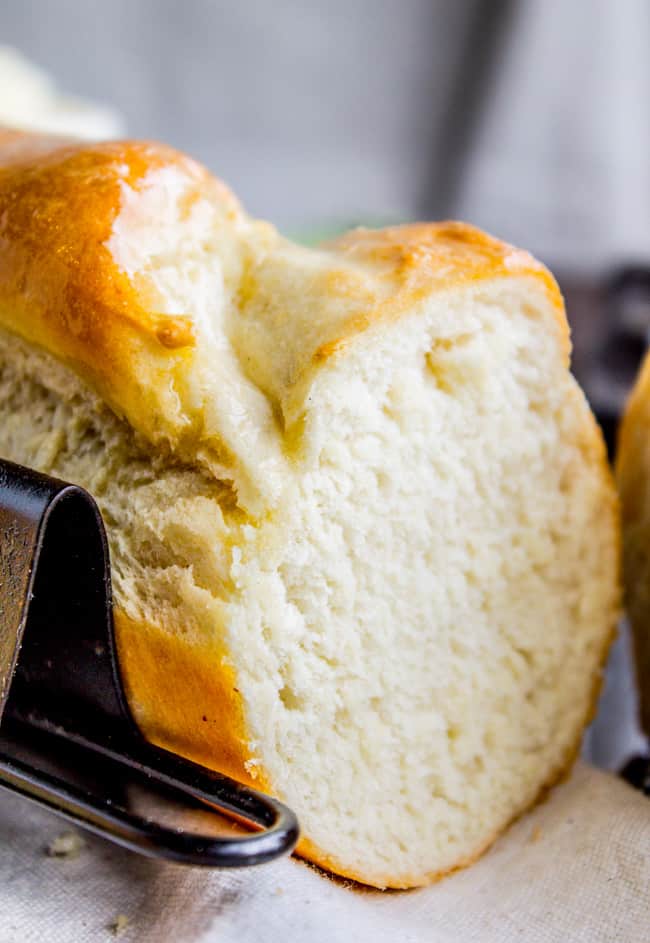 One Hour French Bread from The Food Charlatan. This delicious yeasty French bread recipe has only one 20-minute rise before going into a screaming hot oven for another 20 minutes. At the end you have golden crusty goodness just waiting to be slathered in butter or dipped in oil and balsamic! One hour, I promise!! #french #bread #homemade #easy #ideas #baguette #quick loaf of homemade French bread in a baguette pan.