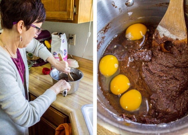 mixing flour and eggs into brownie batter.