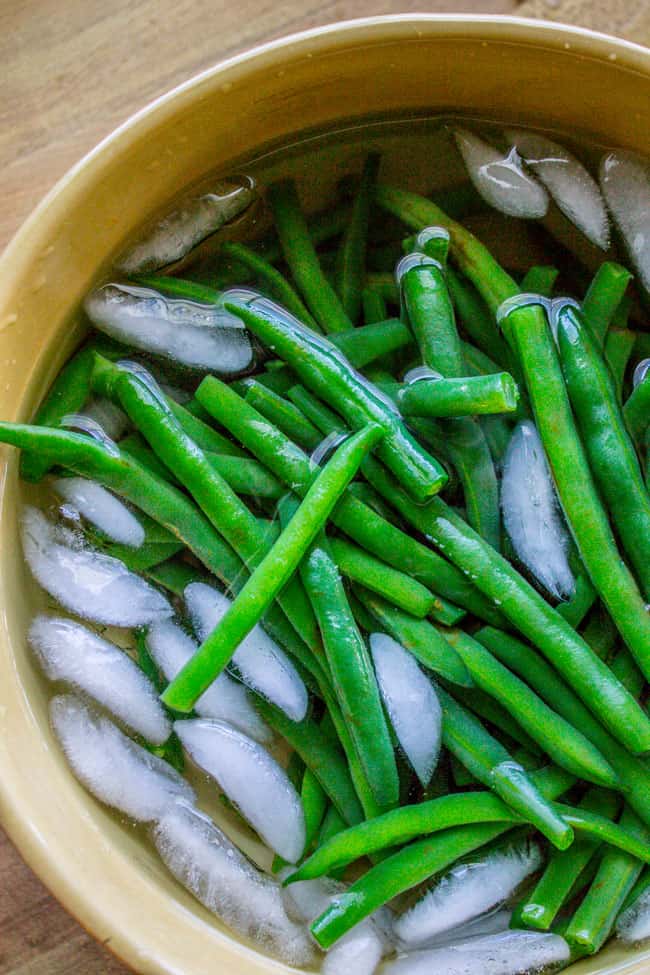 Lemon Dijon Green Beans Almondine from The Food Charlatan. Lemon Dijon Green Beans Almondine is super easy and has tons of flavor! How can you go wrong with butter (and maybe browning it a little?) and lemon and Dijon? You can even make this ahead of time if you plan to serve it for Thanksgiving dinner. #greenbean #almondine #almond #beans #lemon #dijon #mustard #garlic #brownedbutter #butter #sidedish #Thanksgiving #sauteed #fresh #healthy #easy #recipes #withalmonds blanching green beans.