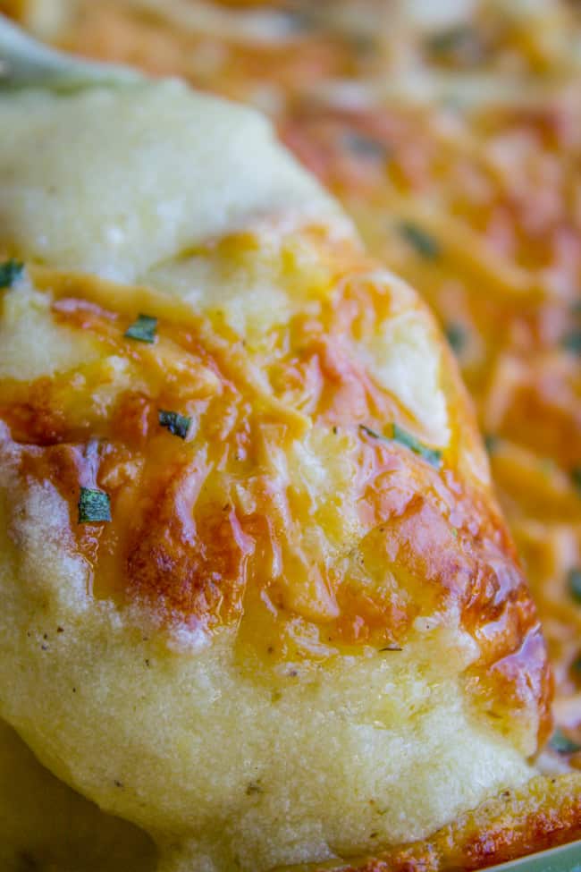 Close up of cheese topped mashed potatoes. 