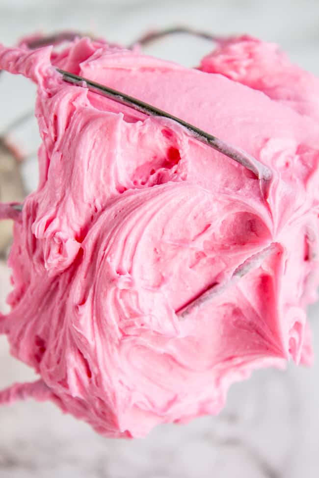Pink sugar cookie frosting on knife