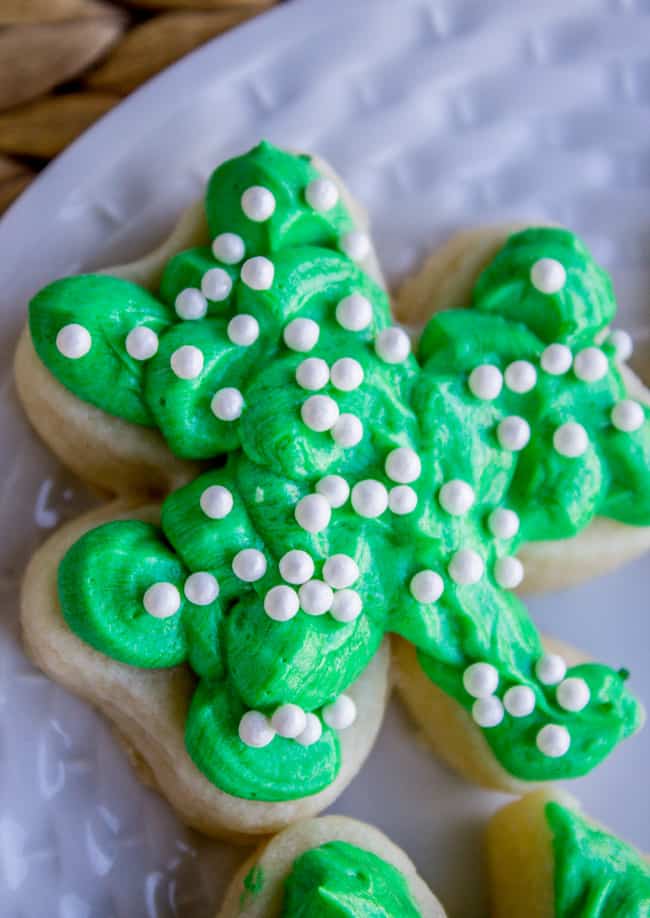 St. Patrick's Day sugar cookie with green frosting with sprinkles on top; close up.