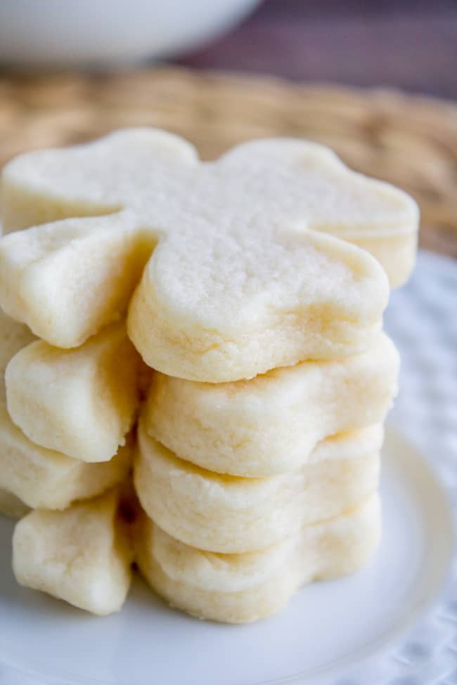 a stack of unfrosted shamrock-shaped cookies.