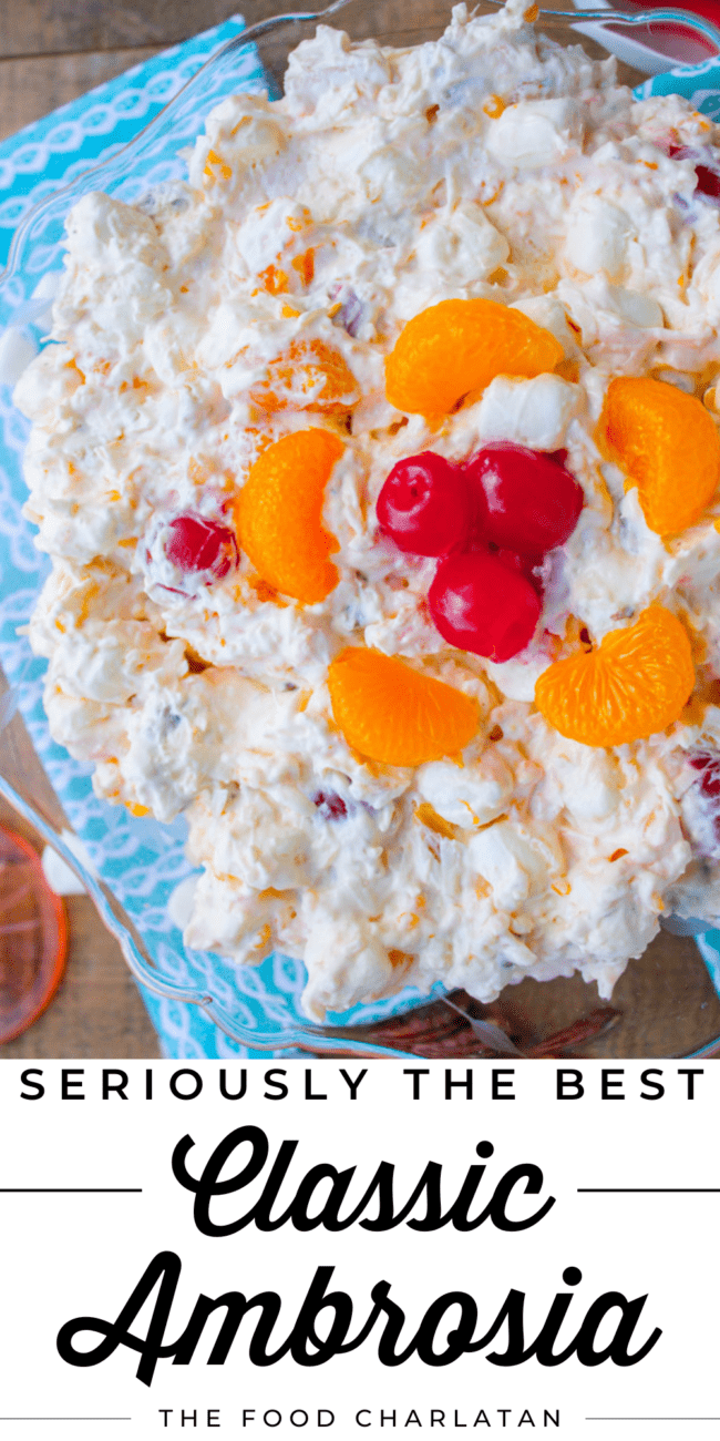 ambrosia salad with mandarin oranges in a glass serving bowl.