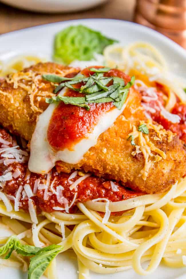 Pasta with marinara sauce topped with crispy fish, mozzarella and basil. 