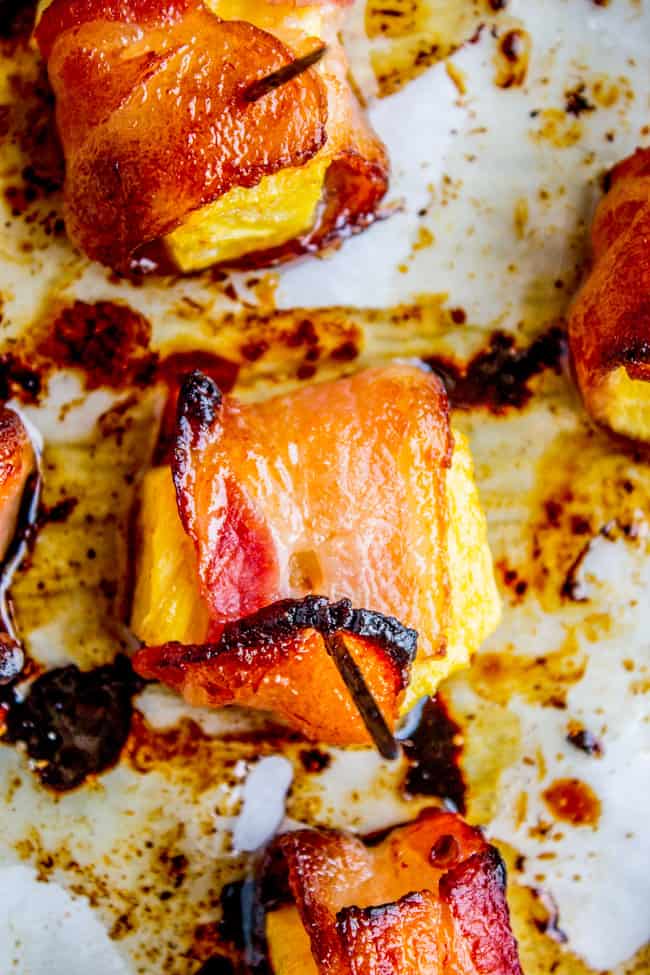 Bacon Wrapped Pineapple  on parchment paper. 