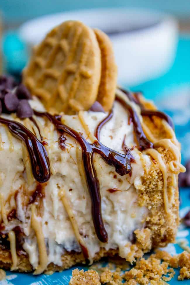 close up shot of frozen peanut butter pie with hot fudge.