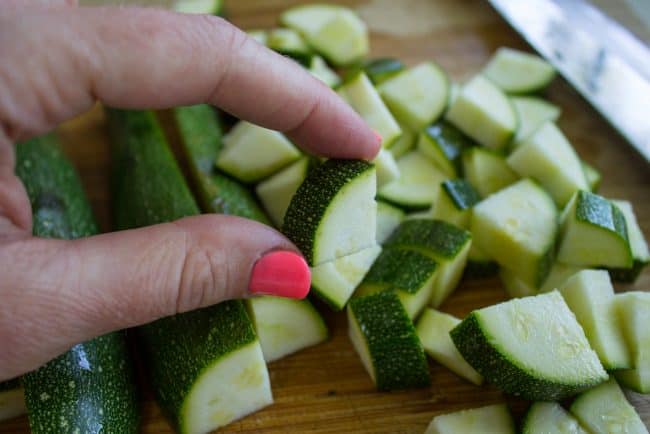 diced zucchini on a cutting board. 
