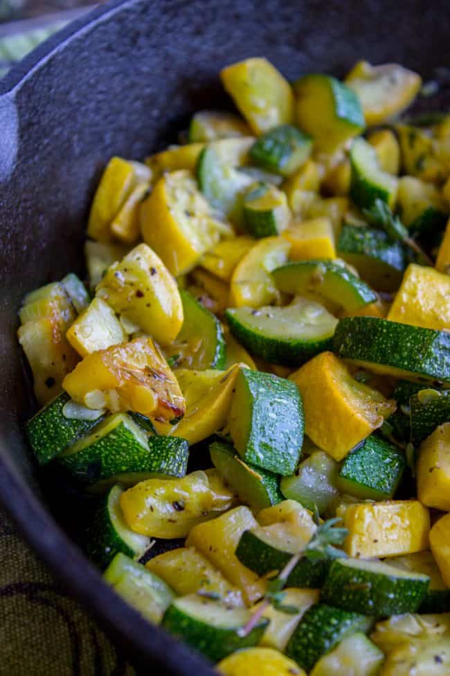 sauteed zucchini and squash in a blue serving bowl. 
