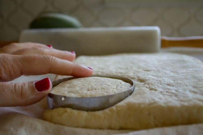homemade buttermilk biscuits from scratch, cutting the dough.