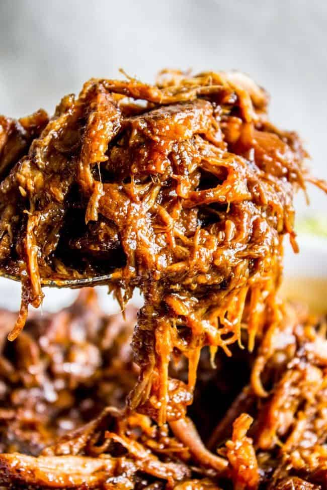 Shredded pork in a big spoon. 
