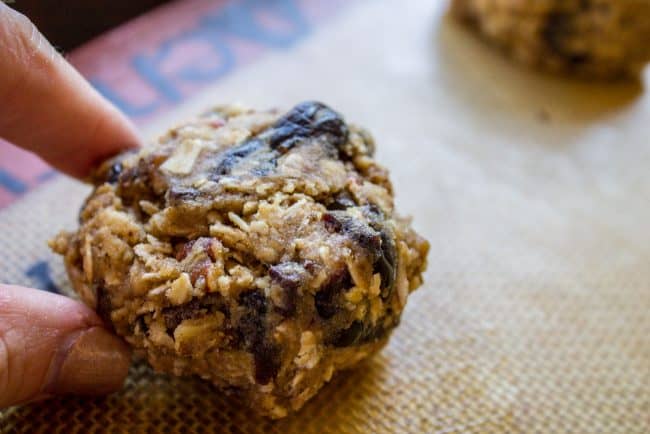 One rolled ball of cookie dough on silpat. 