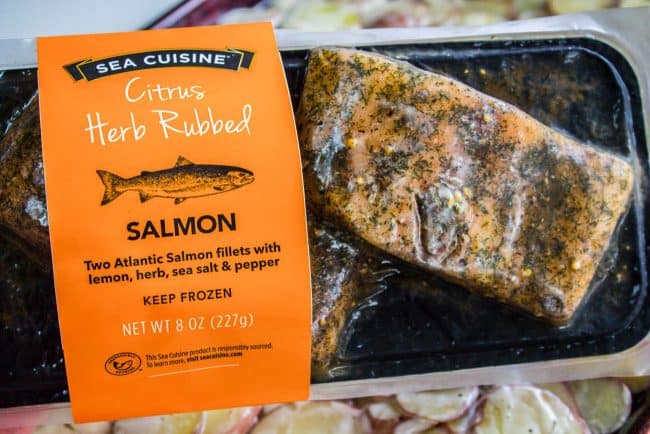 Sheet Pan Salmon with Creamy Scalloped Potatoes and Asparagus from The Food Charlatan. Don't you just love sheet pan dinners?? They are so easy and there's only ONE DISH to wash! This Citrus Herb Salmon is paired with creamy scalloped potatoes and fresh asparagus to make a super easy, pretty healthy, and DELICIOUS one pan meal. #dinner #asparagus #sheetpan #onepan #salmon #lemon #healthy #roastedsalmon #easy #quick #herb #potatoes #creamy #recipe #mealprep #weeknight #salmonrecipesbaked #salmondinner #onesheetpanmeals #sheetpanmeals Citrus Herb rubbed salmon