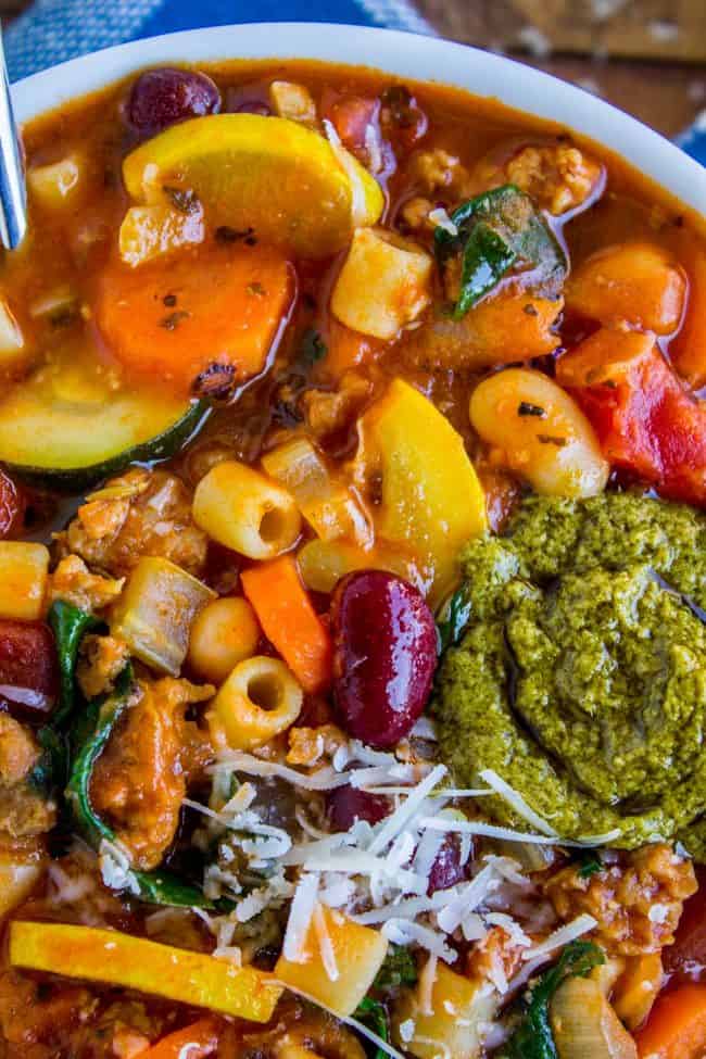 minestrone soup in a bowl with pesto.