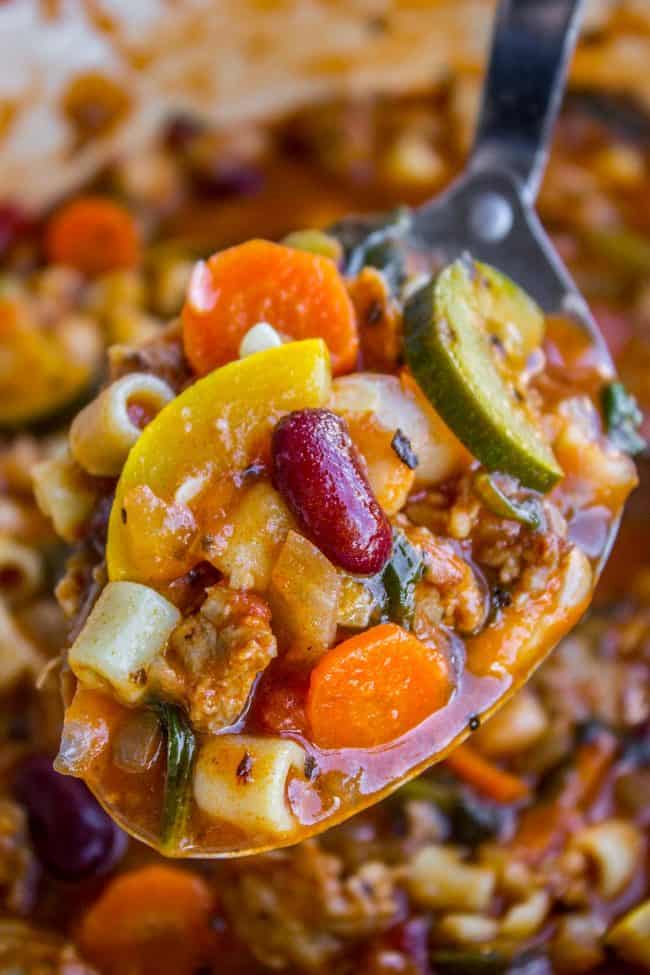 spoonful of minestrone soup with beans.
